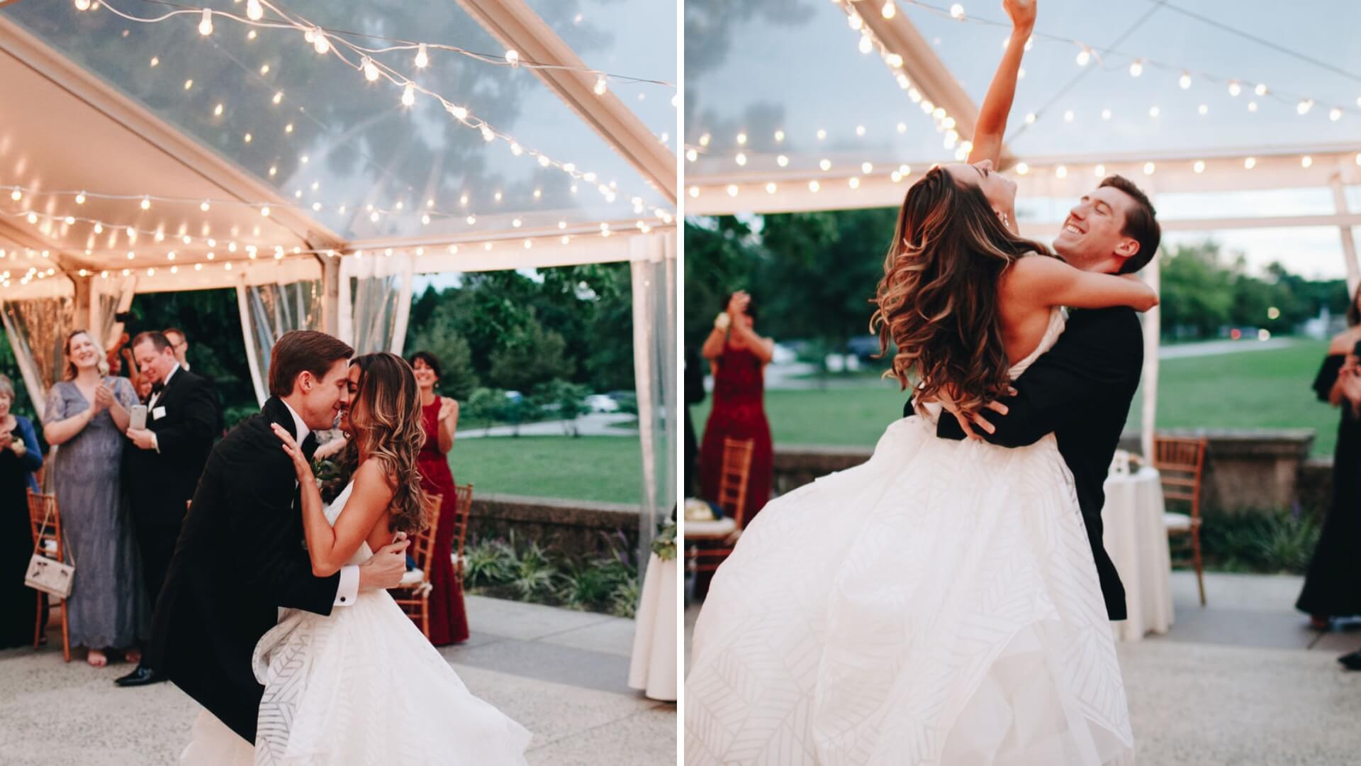 Wedding couple dances under string lights in an outdoor tent, surrounded by guests.