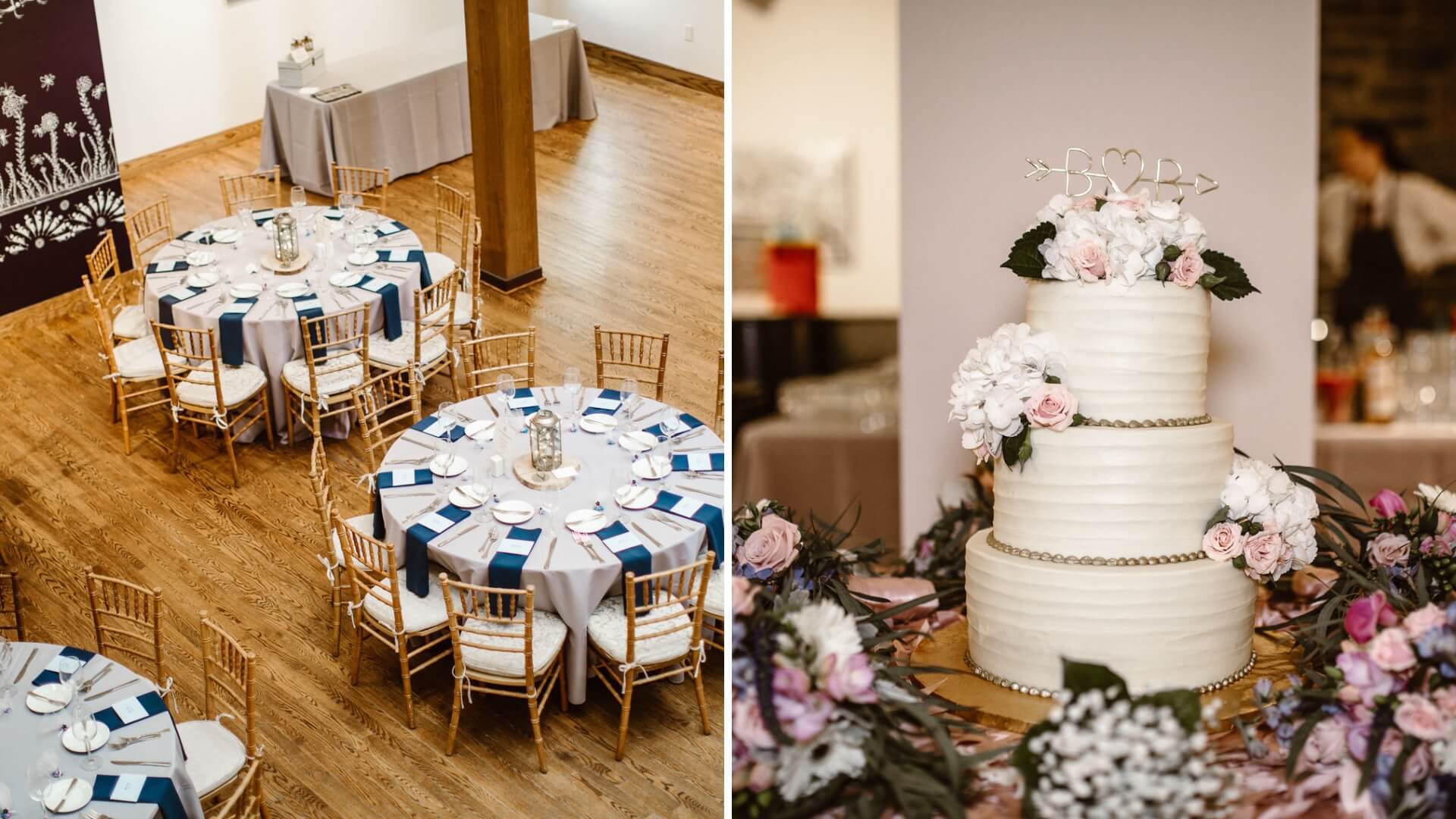A decorated event space with round tables set for dining, featuring blue and white napkins. Adjacent is a three-tiered white wedding cake adorned with flowers and a "D-R" topper.